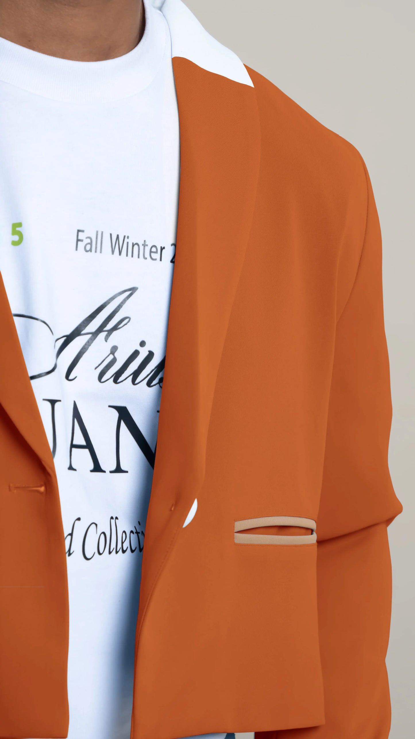 Photo of model in the Arius Juan Nature's Gift: Burnt Orange Cropped Blazer posing for product picture.