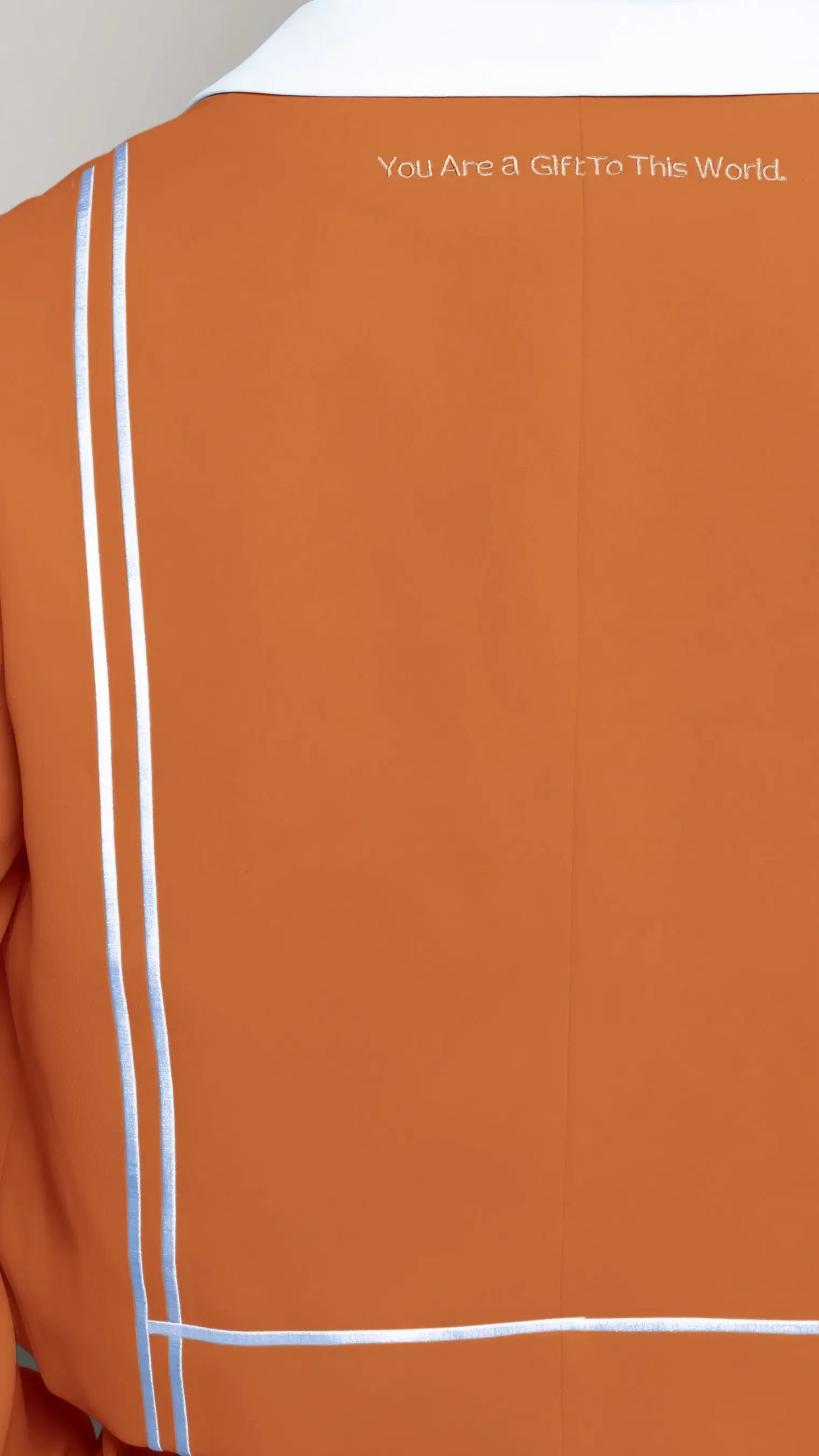 Photo of model in the Arius Juan Nature's Gift: Burnt Orange Cropped Blazer posing for product picture.