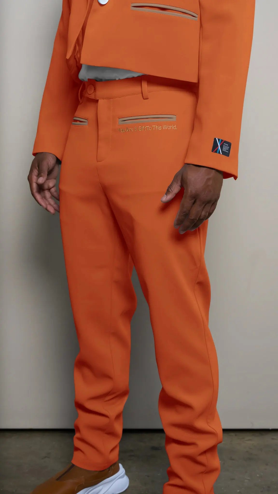 Photo of model in the Arius Juan Nature's Gift: Burnt Orange Pants posing for product picture.