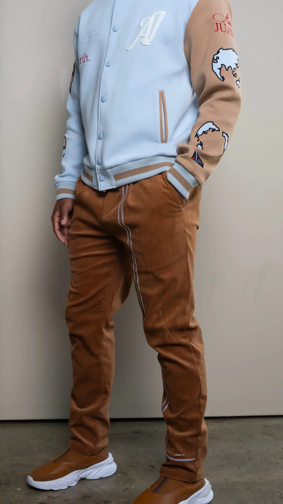 Photo of model in the Arius Juan NY vs NY Corduroy Pants posing for product picture.