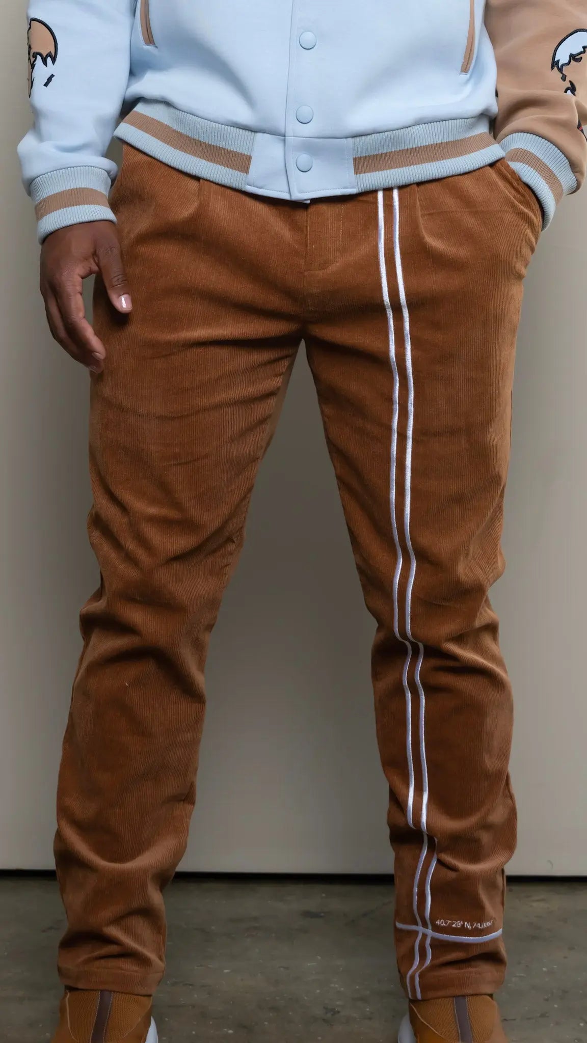 Photo of model in the Arius Juan NY vs NY Corduroy Pants posing for product picture.