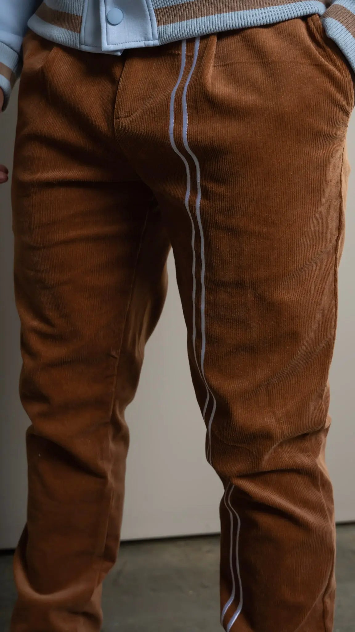 Photo of model in the Arius Juan NY vs NY Corduroy Pants posing for product picture.