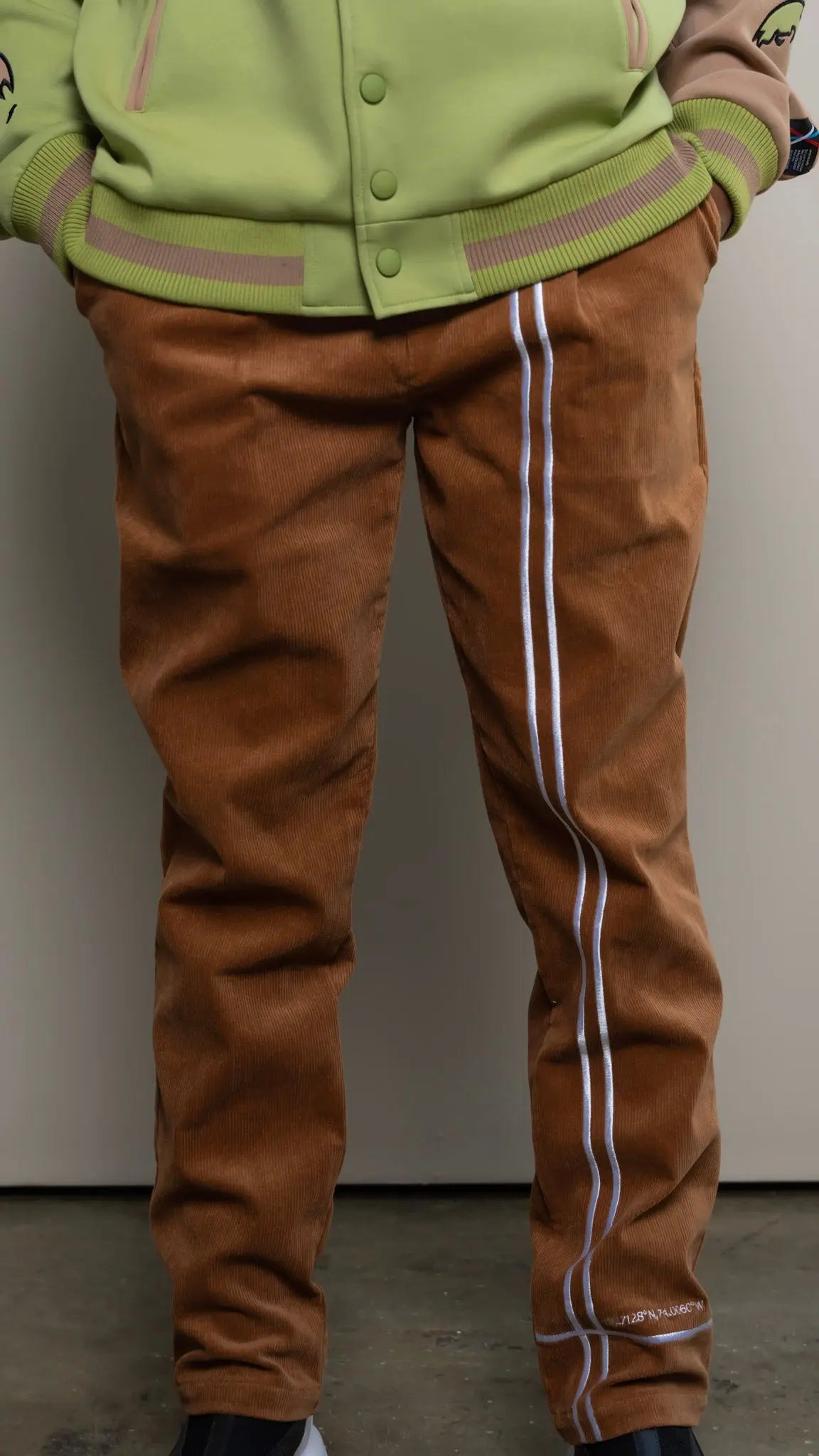 Photo of model in the Arius Juan NY vs NY Corduroy Pants posing for product picture.
