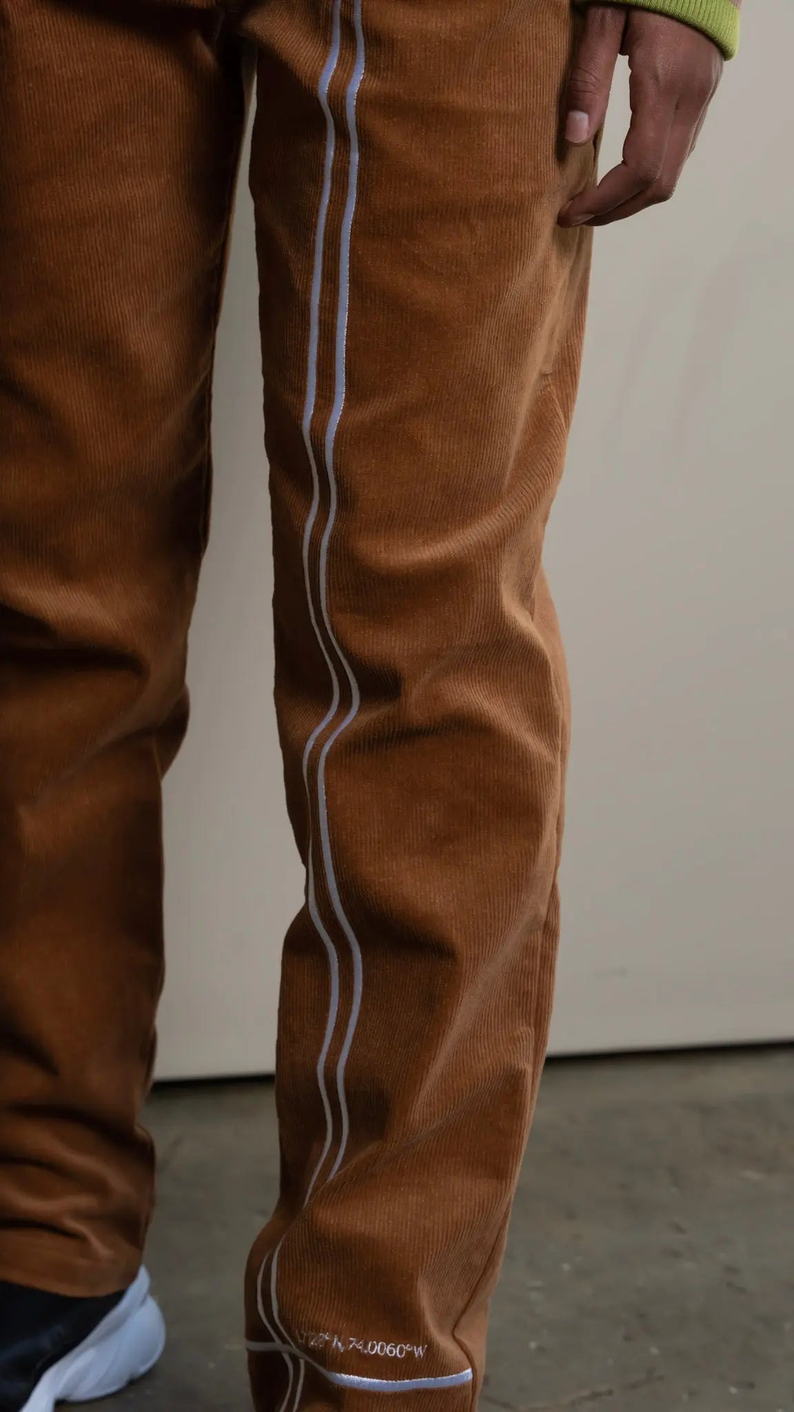 Photo of model in the Arius Juan NY vs NY Corduroy Pants posing for product picture.