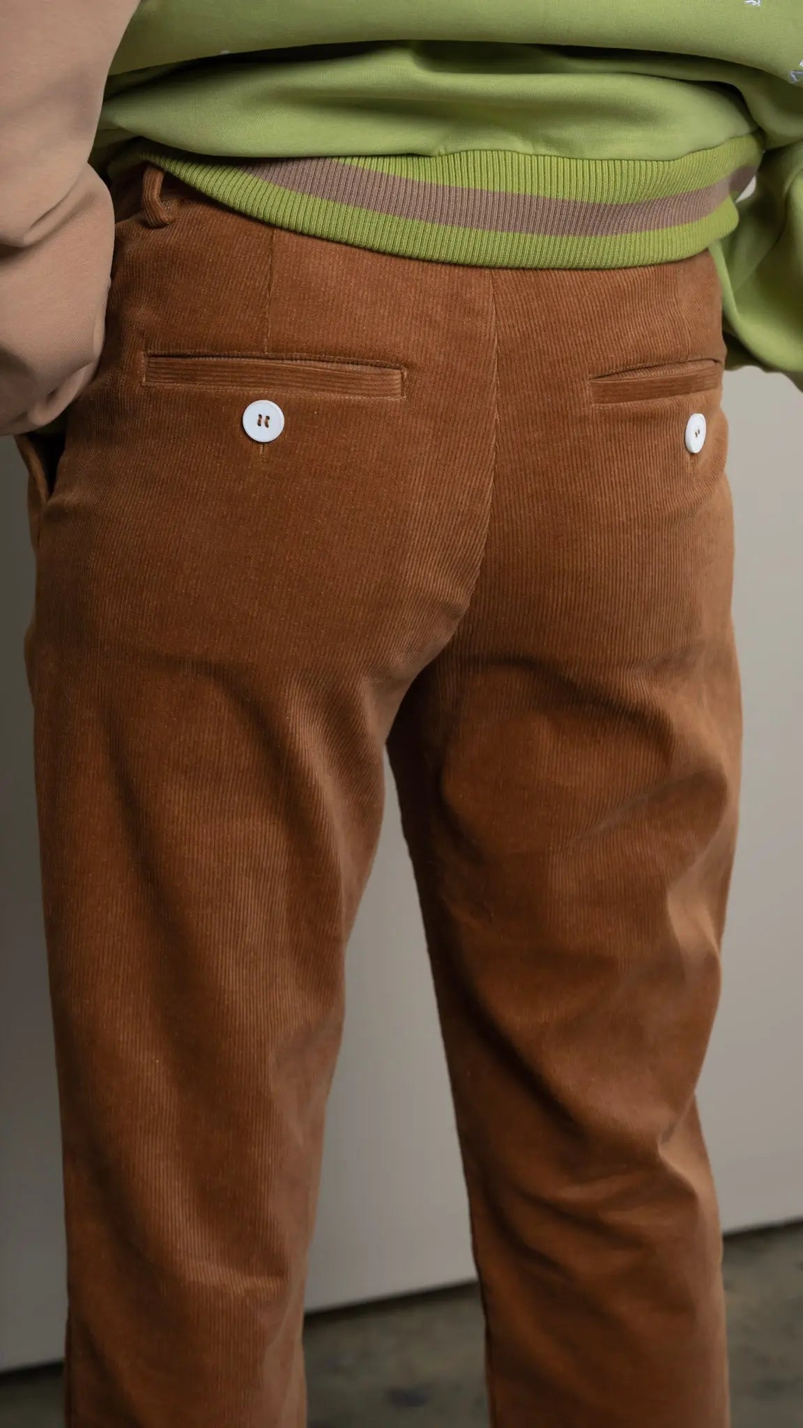 Photo of model in the Arius Juan NY vs NY Corduroy Pants posing for product picture.