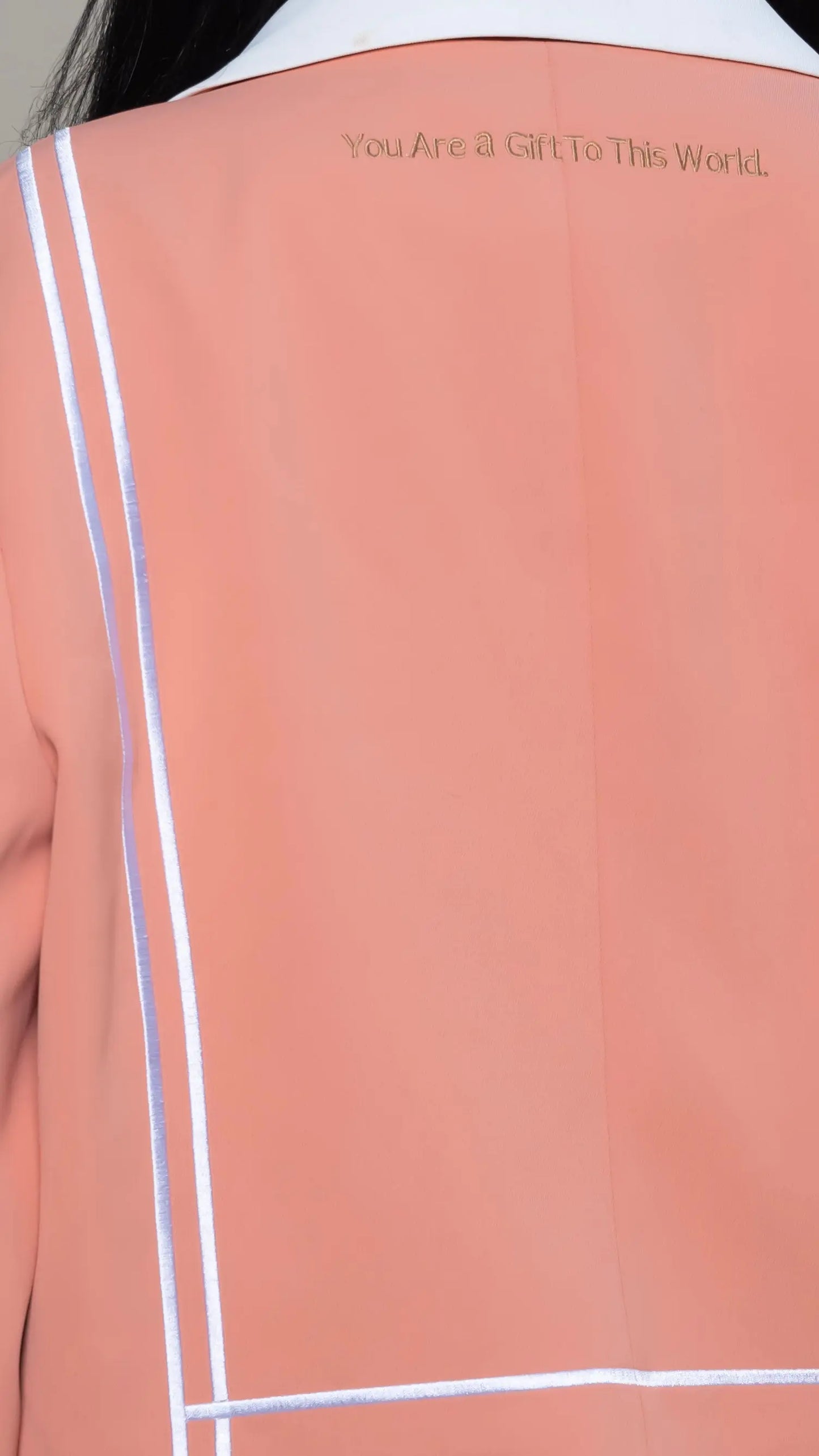 Photo of model in the Arius Juan Nature's Gift: Salmon Pink Cropped Blazer posing for product picture.