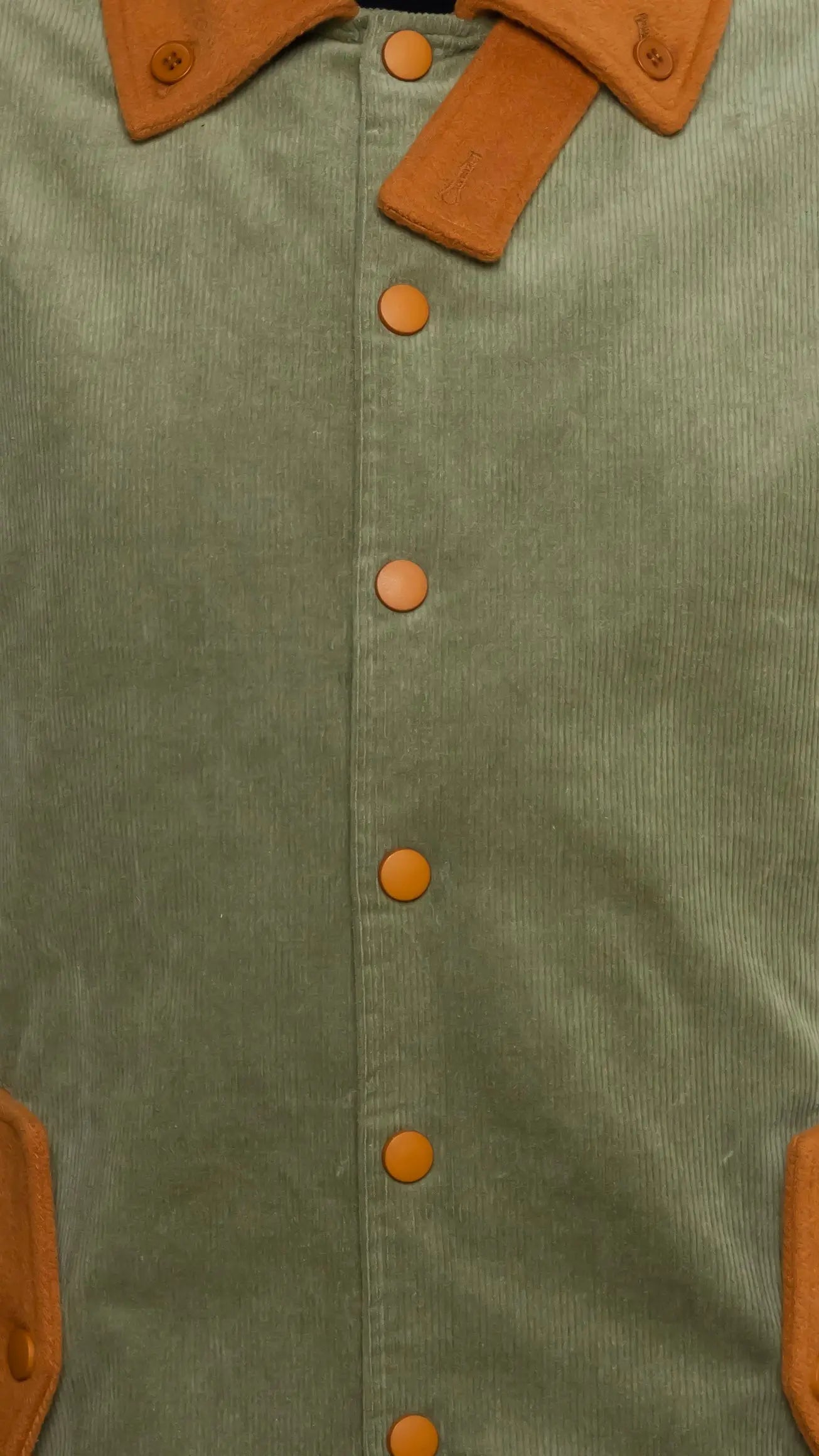 Photo of model in the Arius Juan Olive Green Earthly Trench Coat posing for product picture.