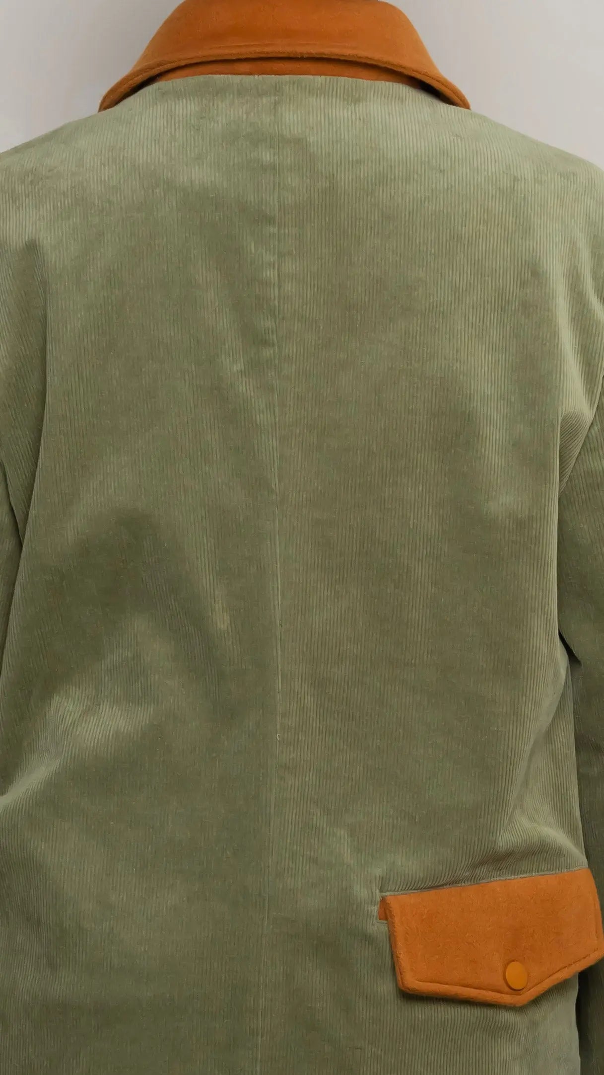 Photo of model in the Arius Juan Olive Green Earthly Trench Coat posing for product picture.