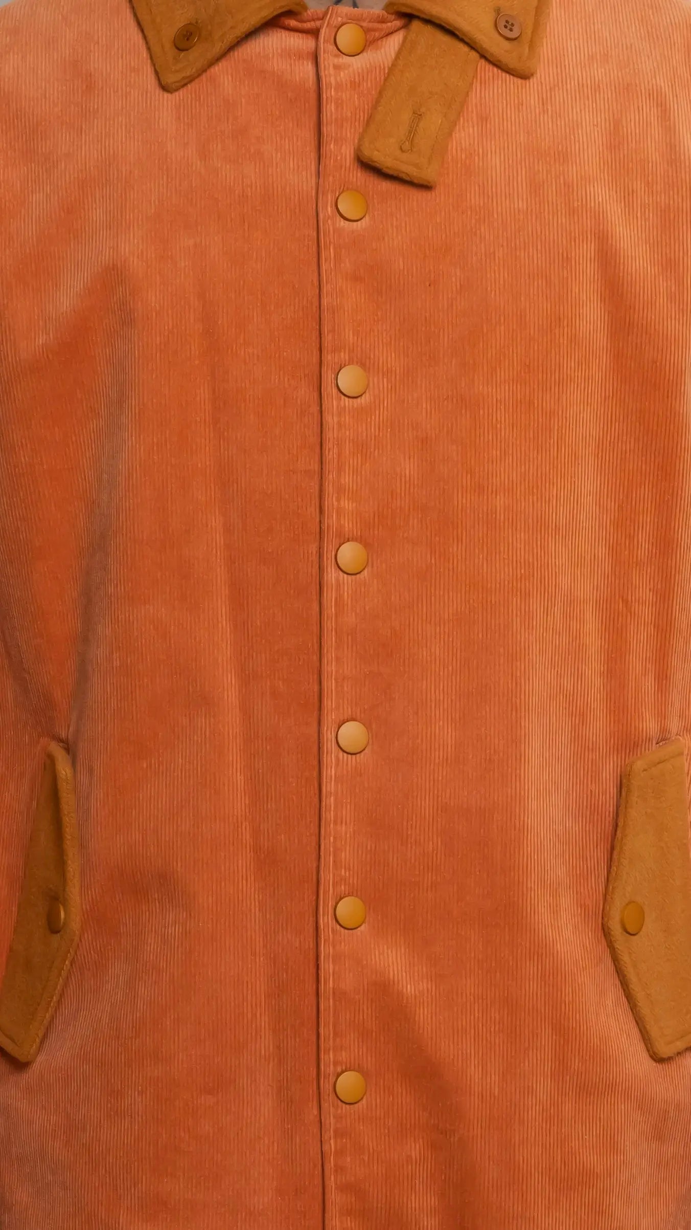 Photo of model in the Arius Juan Burnt Orange Earthly Trench Coat posing for product picture.