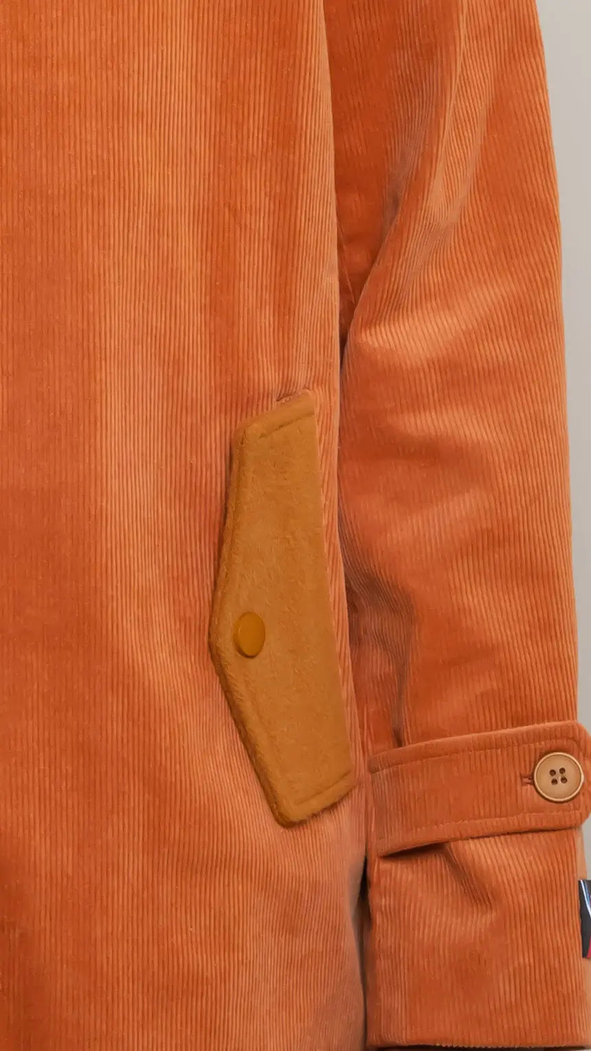Photo of model in the Arius Juan Burnt Orange Earthly Trench Coat posing for product picture.