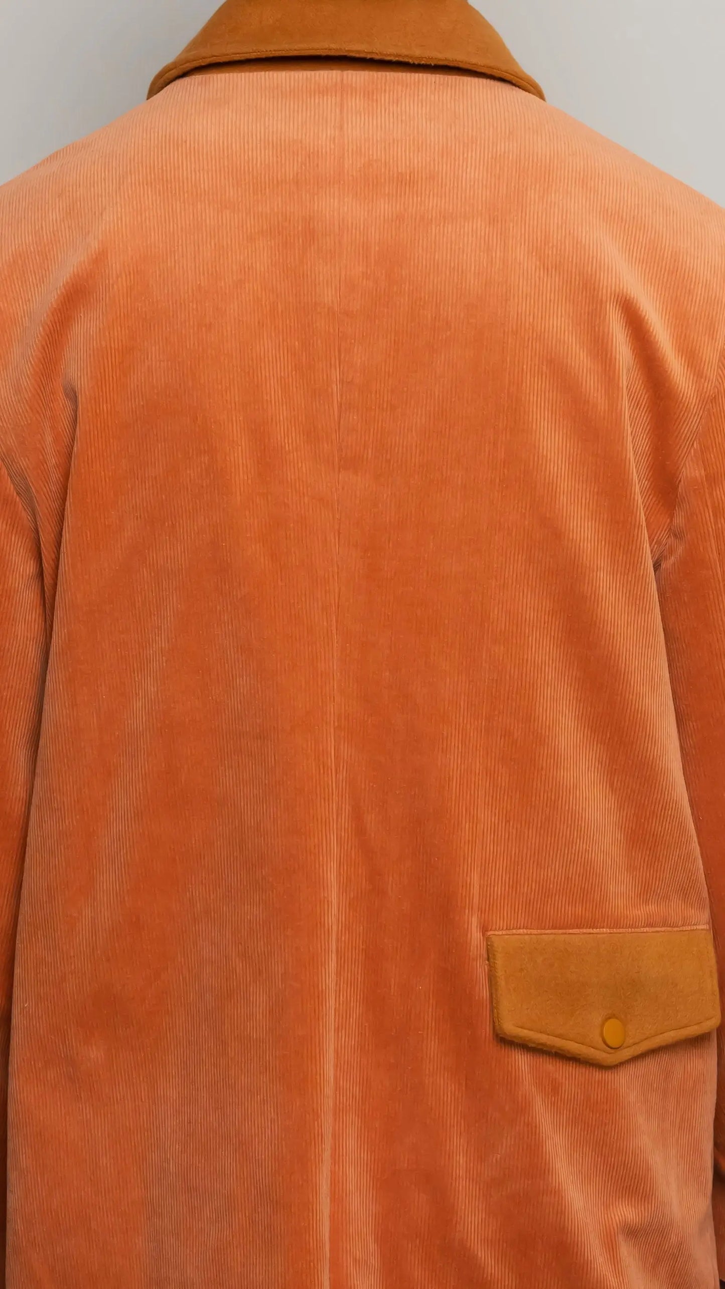 Photo of model in the Arius Juan Burnt Orange Earthly Trench Coat posing for product picture.