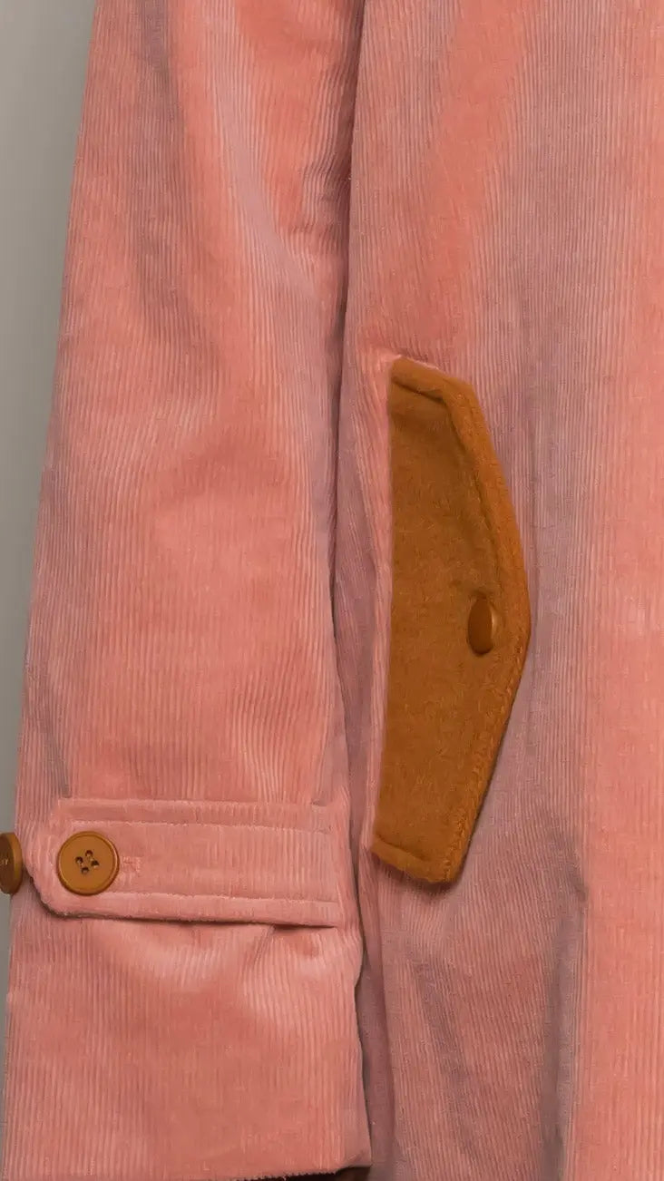 Photo of model in the Arius Juan Salmon Pink Earthly Trench Coat posing for product picture.