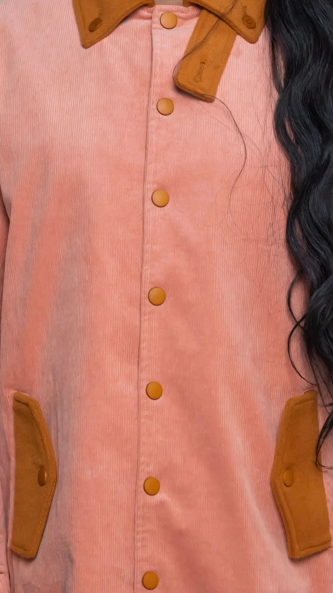Photo of model in the Arius Juan Salmon Pink Earthly Trench Coat posing for product picture.