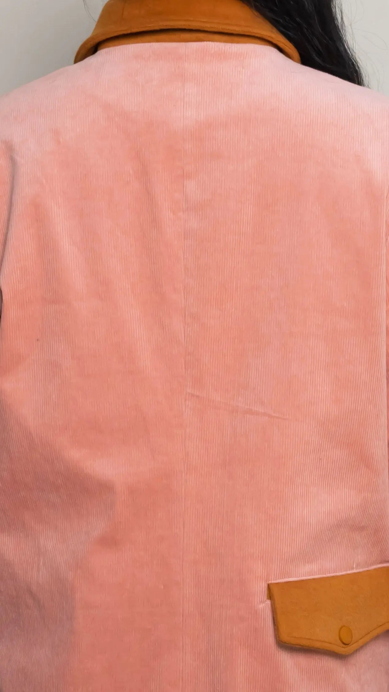 Photo of model in the Arius Juan Salmon Pink Earthly Trench Coat posing for product picture.