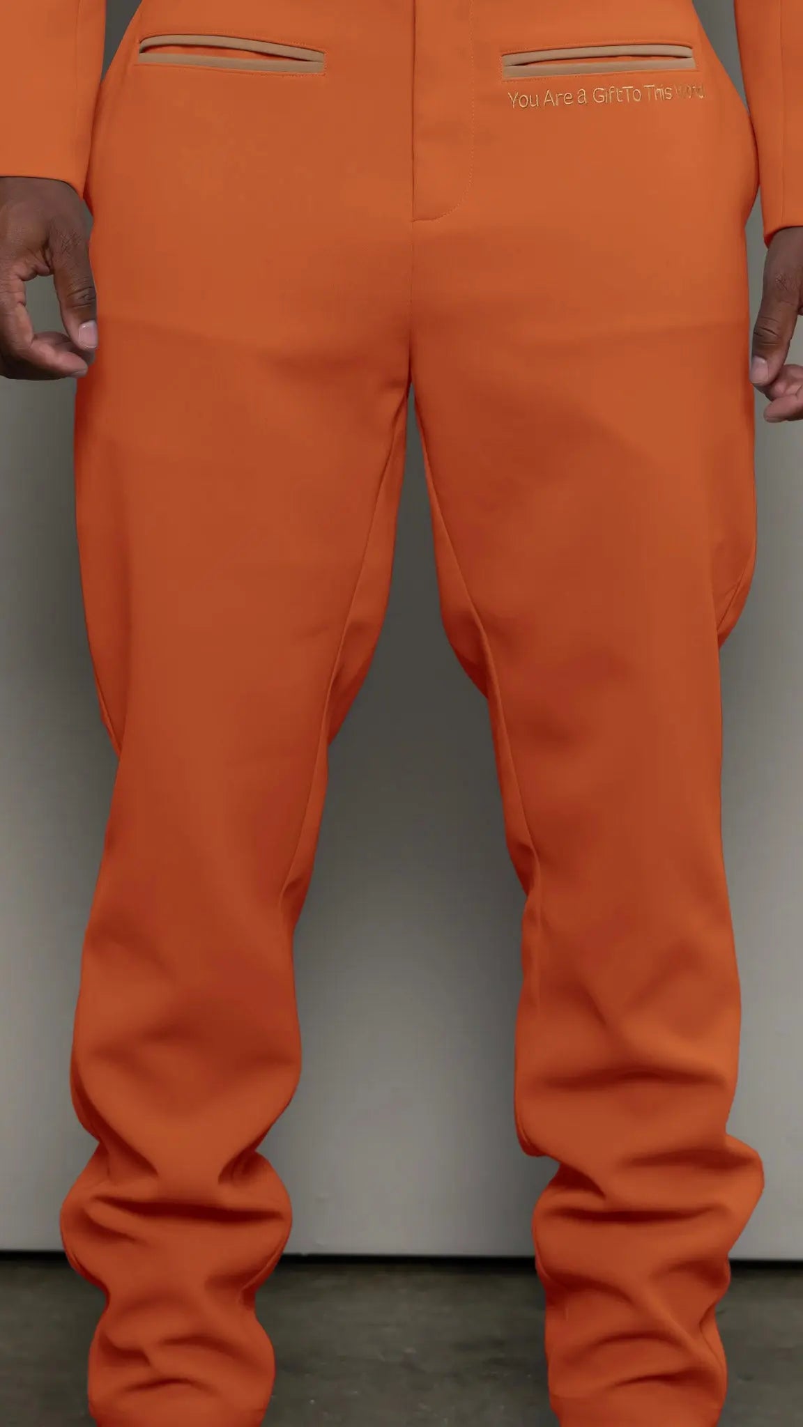 Photo of model in the Arius Juan Nature's Gift: Burnt Orange Pants posing for product picture.