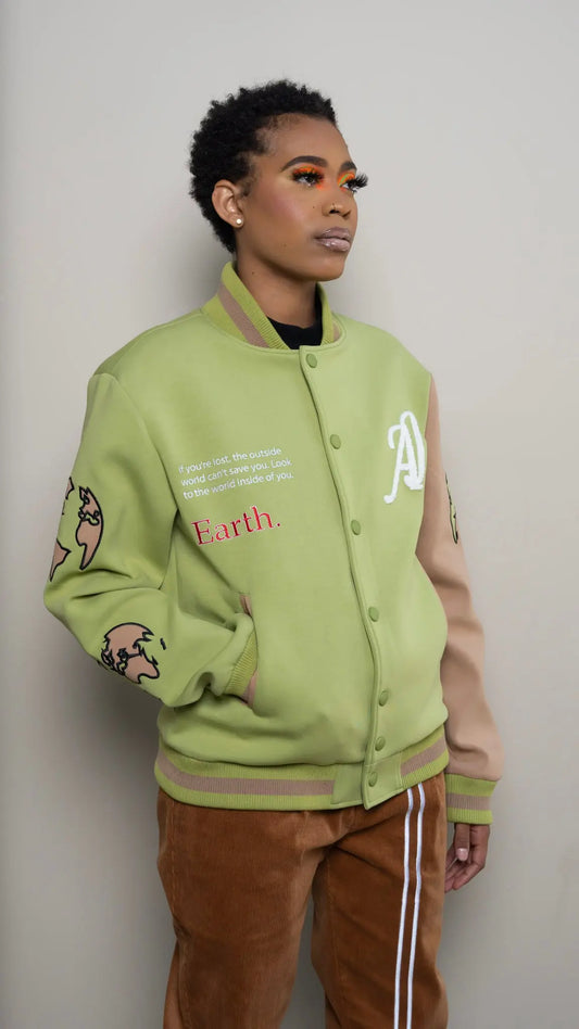 Photo of model in the Arius Juan Olive Green Worldly Letterman Jacket posing for product picture.