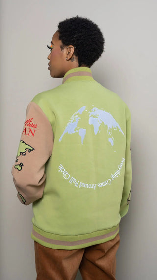 Photo of model in the Arius Juan Olive Green Worldly Letterman Jacket posing for product picture.