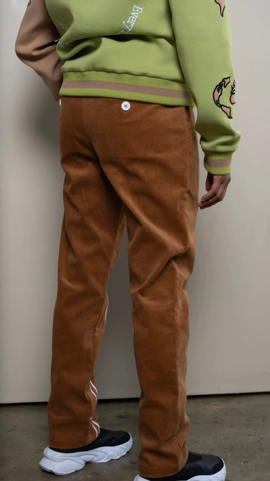 Photo of model in the Arius Juan NY vs NY Corduroy Pants posing for product picture.