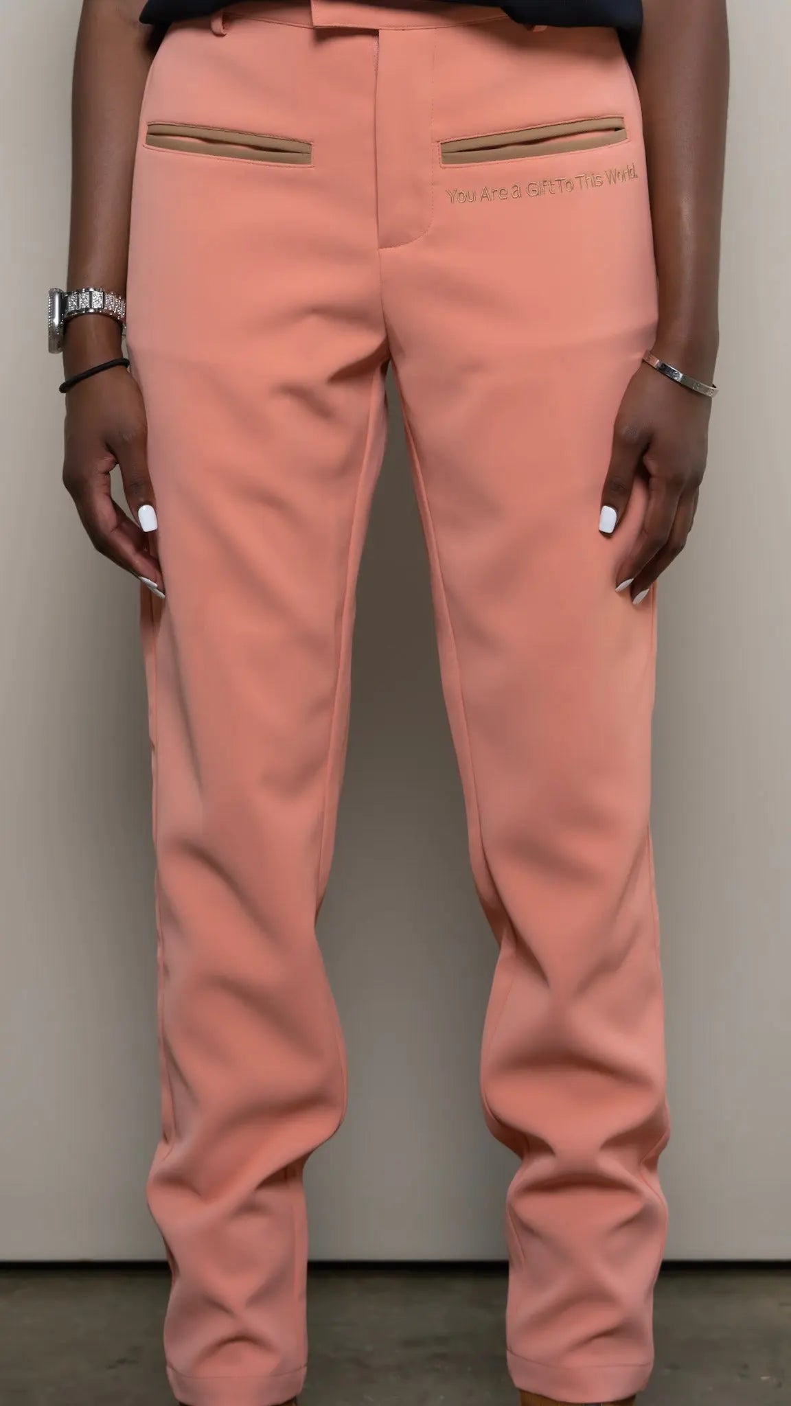 Photo of model in the Arius Juan Nature's Gift: Salmon Pink Pants posing for product picture.