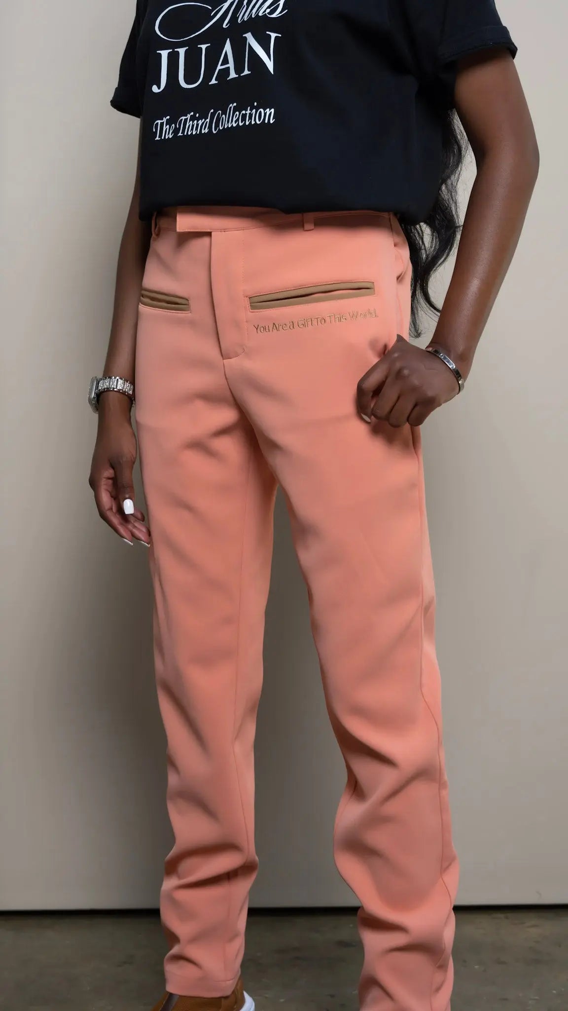 Photo of model in the Arius Juan Nature's Gift: Salmon Pink Pants posing for product picture.