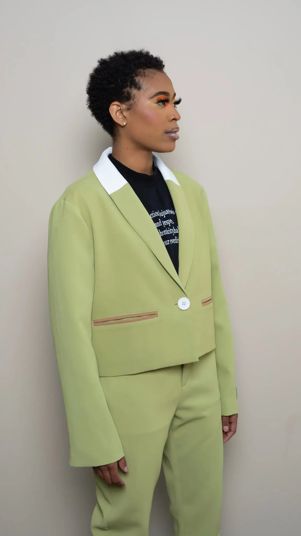 Photo of model in the Arius Juan Nature's Gift: Olive Green Cropped Blazer posing for product picture.