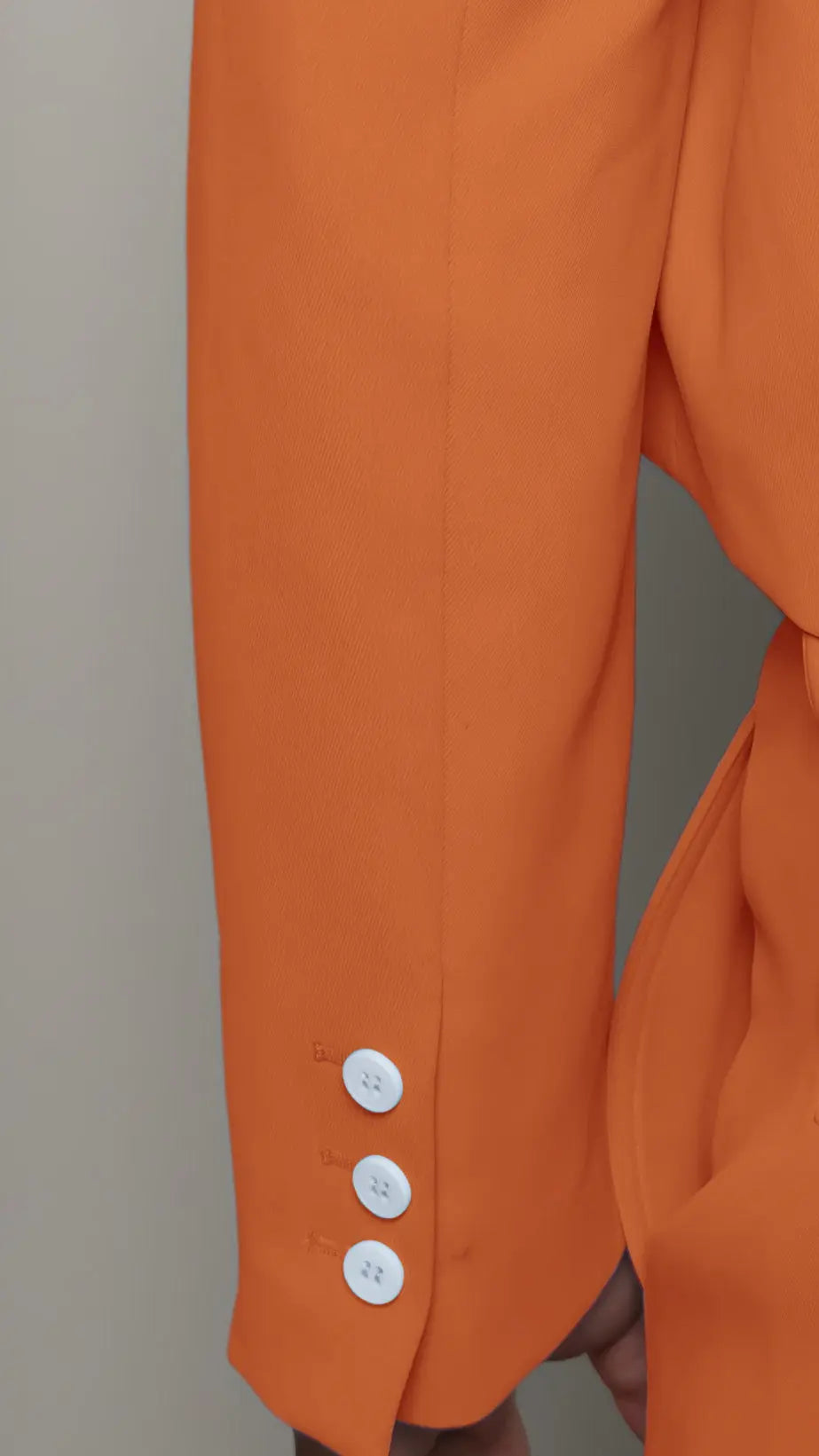 Photo of model in the Arius Juan Nature's Gift: Burnt Orange Cropped Blazer posing for product picture.